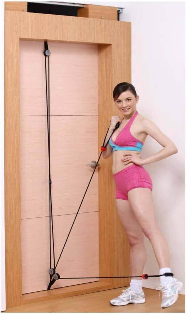 Woman using LumiPuro VoimaOte resistance bands for upper body workout at home.